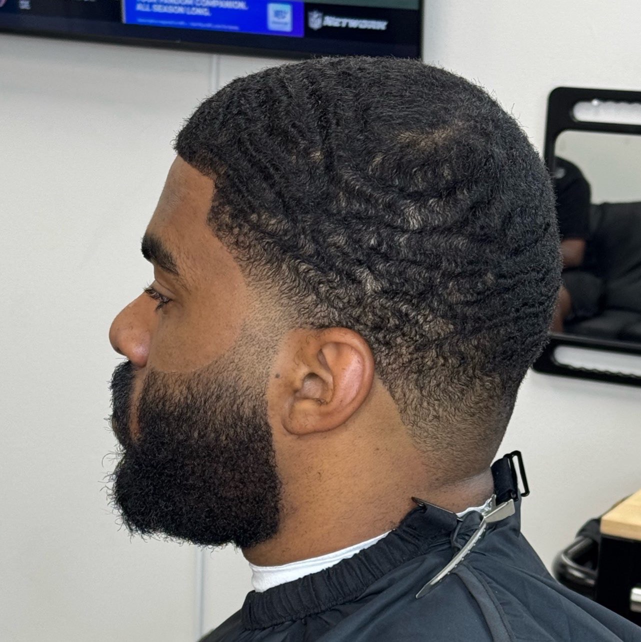 Deep waves with taper fade and beard blend